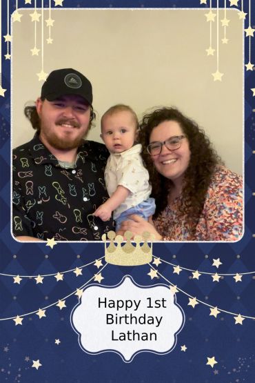 Family celebrates Lathan's 1st birthday with smiles and love.