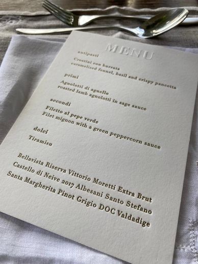 an example of a menu from the Cosmos suite. Embossed title with gold text.