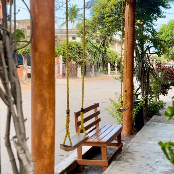 street view with a swing and bench