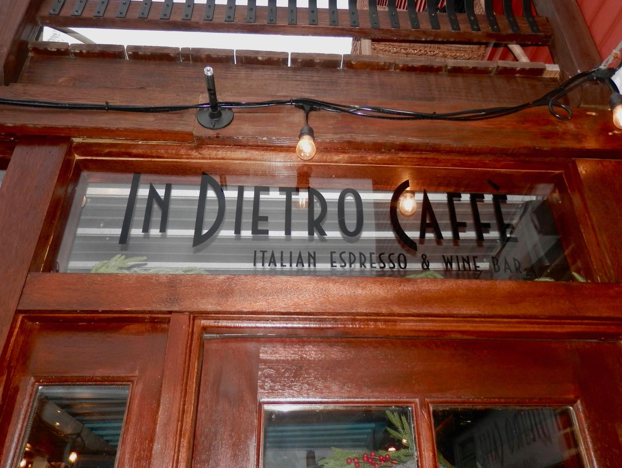 Entrance to In Dietro Caffè, an Italian espresso and wine bar.