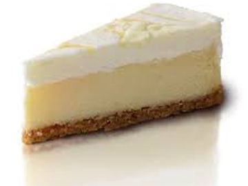 A slice of creamy cheesecake with a golden crust.