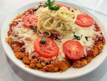 Chopped chicken breast coated with breadcrumbs, marinara sauce, melted mozzarella fontina cheese mix