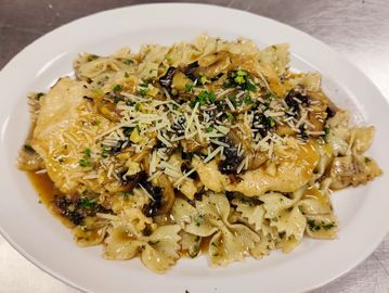 Pounded Chicken, bowtie pasta, mushrooms, marsala sauce, garlic, Italian parsley, and shallots.