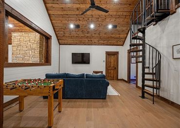 Upstairs game room with foosball and loft overlooking.