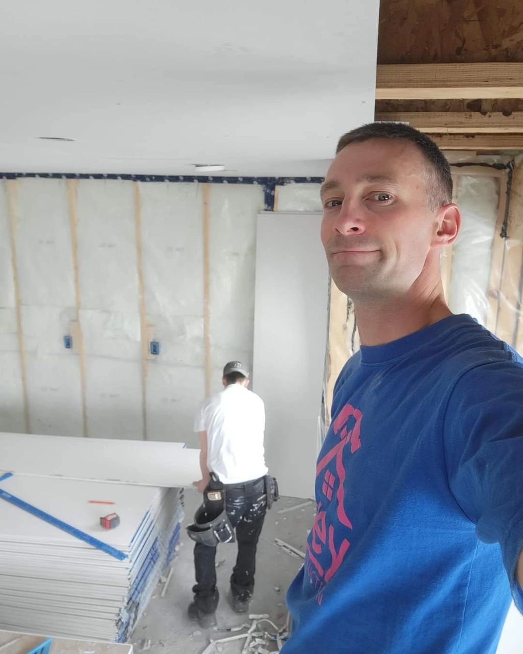 Drywalling a basement development in Airdrie.