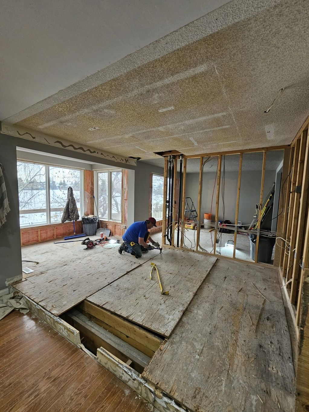 Removing a raised floor during the demo process in a kitchen reno in Edgemont NW Calgary.