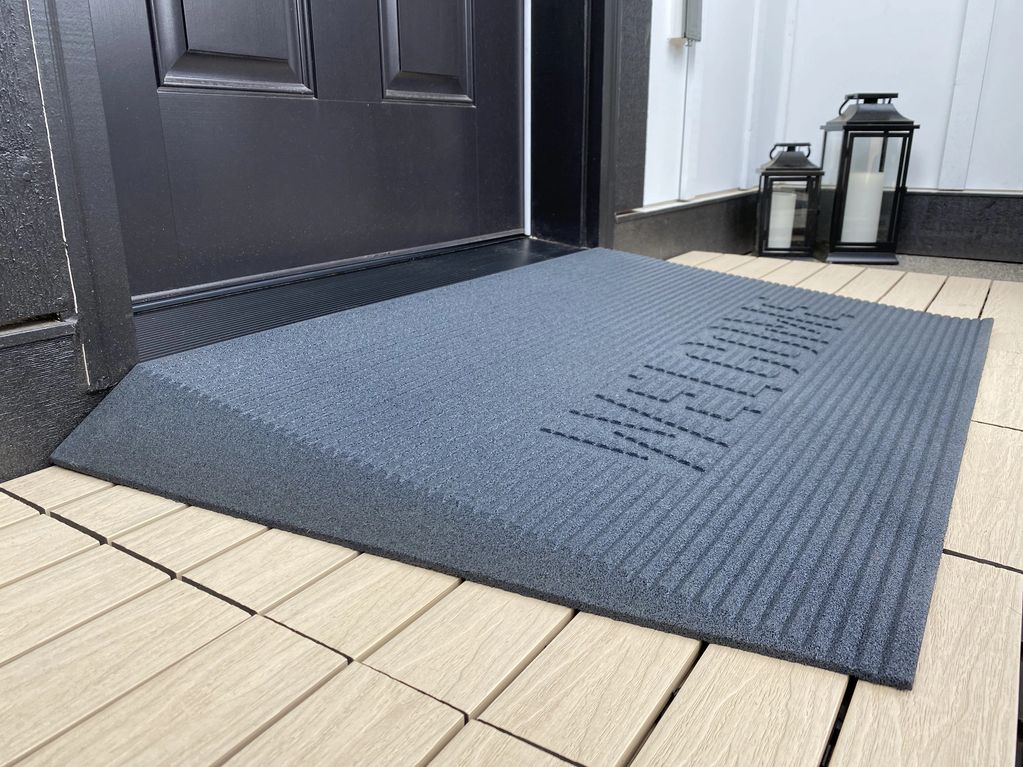 Angled wheelchair access mat for entryway