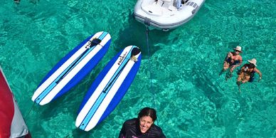 2 blue paddle board. yacht charter includes all water toys