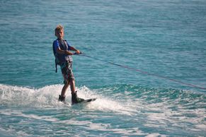 young man water sking in the bahamas during a charter week