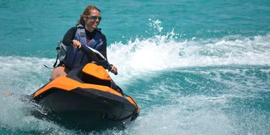 girls on Jetskis. included in yacht charter in The Bahamas