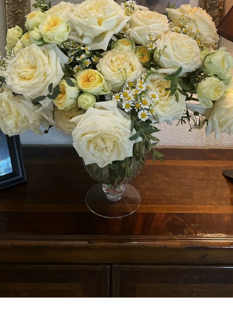 Large white roses with ivory cabbage roses and chamomile