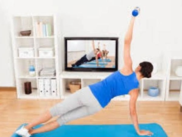 Woman doing side plank exercise.