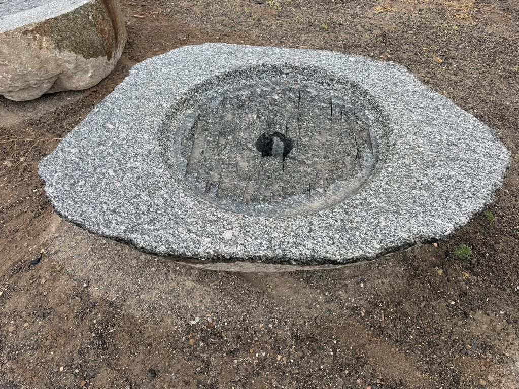 Bush Hammered Granite Boulder Fire Feature.
59"x44"x 14" Height.
36" Round Burner 