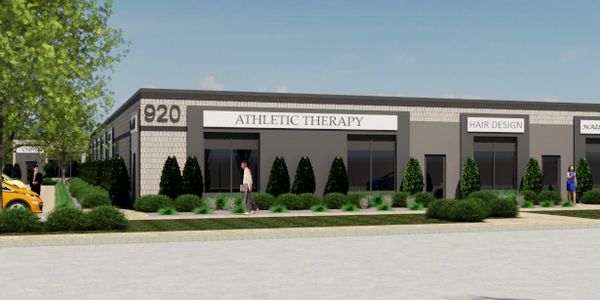 A rendering of a one story business plaza with beige masonry and warm grey stucco entry portals.