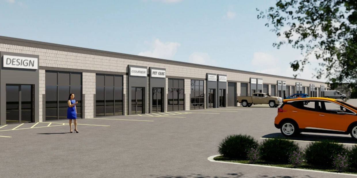 A rendering of a one story business plaza with beige masonry and warm grey stucco entry portals.