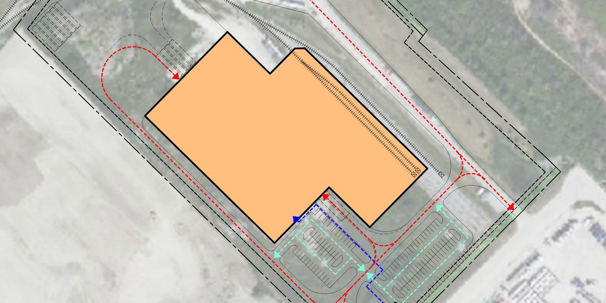 Site plan diagram with color-coded arrows representing vehicle circulation routes