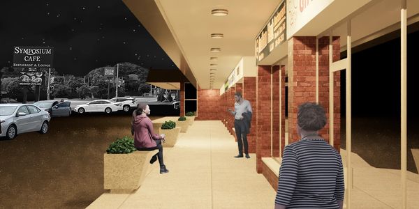 Rendering of a retail plaza's canopy walkway at night well illuminated by ceiling light fixtures.