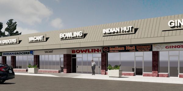 Rendering of a retail plaza in daylight with uniformly spaced signage and storefront entrances.