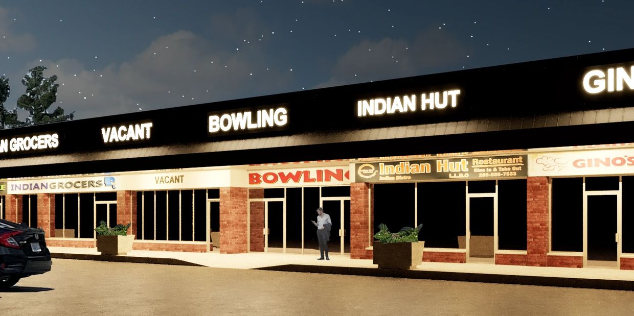 Rendering of a retail plaza at night with uniformly illuminated signage.