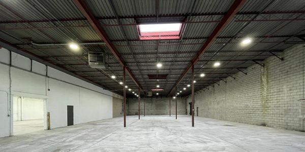 Interior photo of a vacant industrial warehouse.