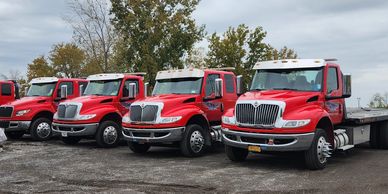 Gates Towing fleet of 5 flatbed trucks lined up