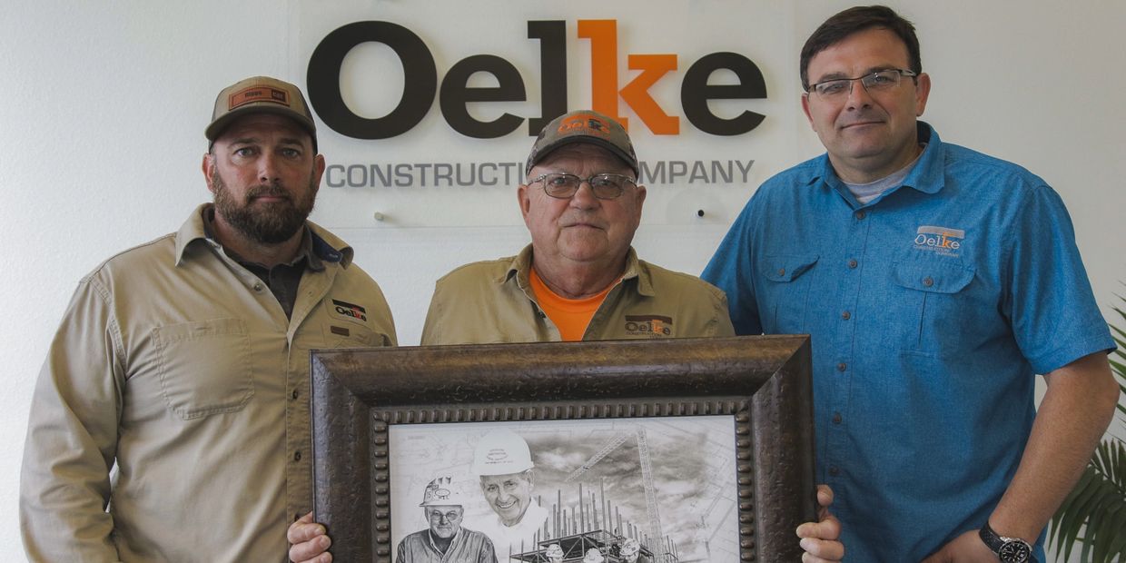 Oelke Brothers with Ernest Oelke. Family business. Construction company co-owners and family photo.