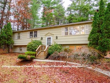 Spacious 3-bedroom home set on a knoll on Pleasant Street in Pembroke Massachusetts.