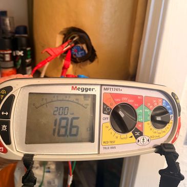 Megger MFT1741+ multimeter displaying a resistance measurement of 18.6 ohms.