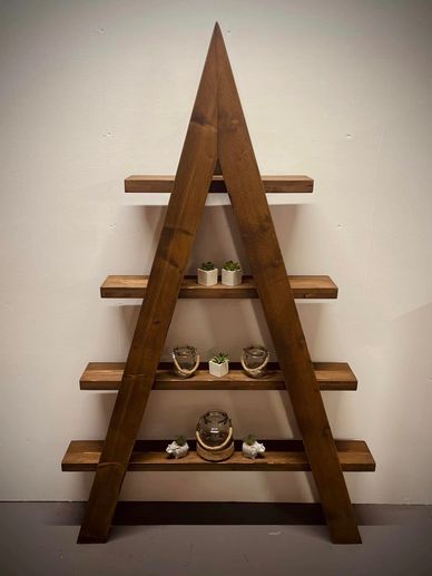 A frame ladder shelf with 4 shelves finished in a dark oak wax