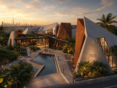 Modern architectural buildings with sharp angles and a reflecting pool at sunset.