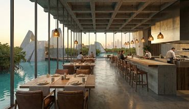 Modern restaurant with water views and chefs preparing food at the counter.