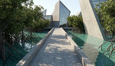 Modern concrete building surrounded by water and mangrove trees.