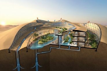 Cutaway view of a sustainable desert building with airflow and water recycling system.
