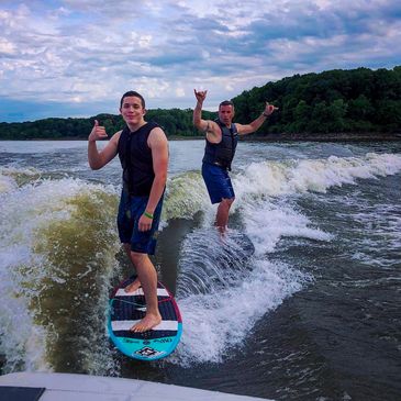 Wakesurfing on the Nautique G23 riding the Hyperlite Buzz and the Hyperlite HiFi