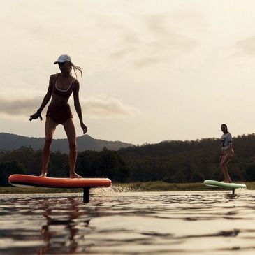 Two women enjoying their Flite Air Fliteboard efoils from Lake House Sports