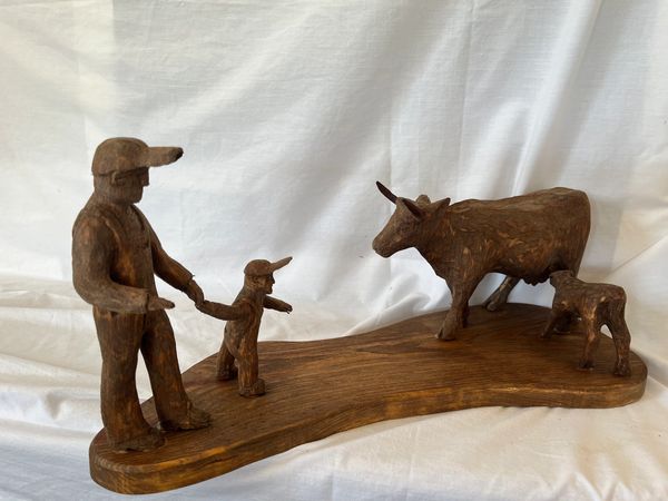 Carved People with Animals in Wood