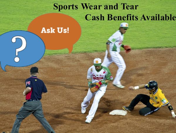 Baseball player sliding into base with umpire and defender nearby.