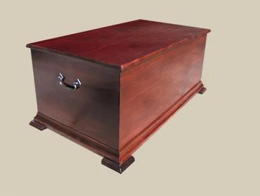 Blanket box in cherry finish.