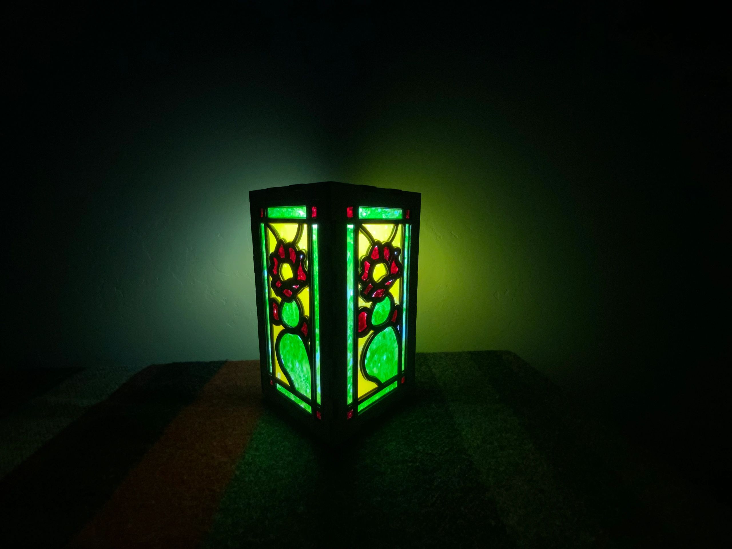 Home accent lantern made from laser cut birch plywood with a tinted epoxy resin inlay. 