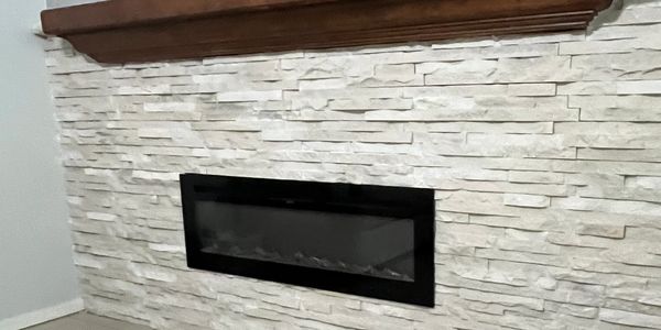 Custom fireplace, decorative brick and mantle by MRC Home Service