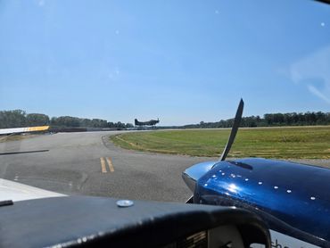 AD Skyraider up at KBVS from the view of a twin Comanche