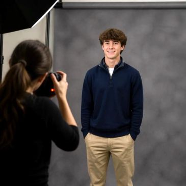 A young man posing for a studio portrait.