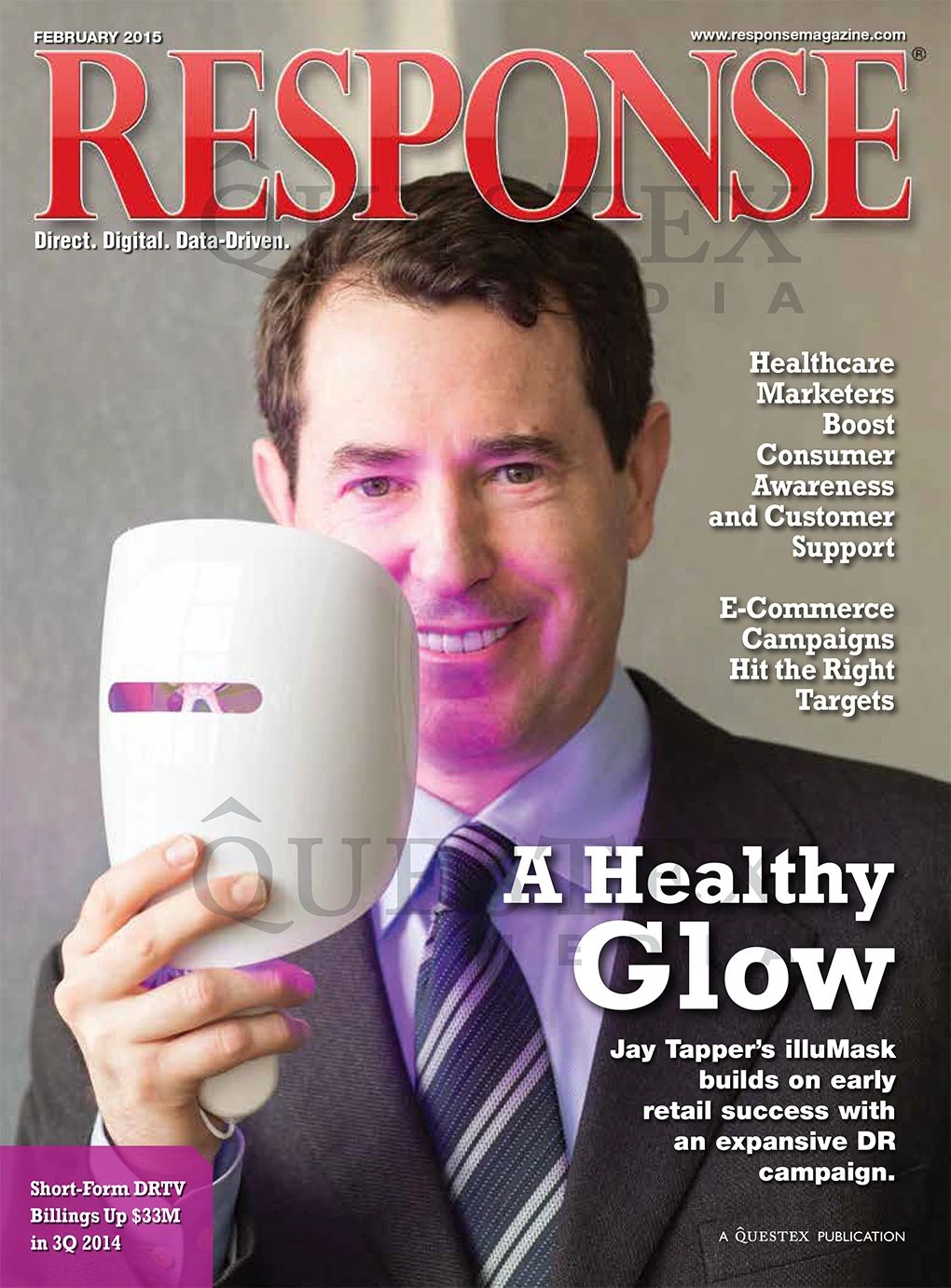 CEO Jay Tapper smiles and holds the acne-fighting illuMask light therapy mask in front of his face