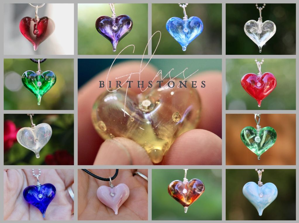 Glass heart-shaped birthstone pendants in various colors.