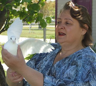 Lady holding a dove