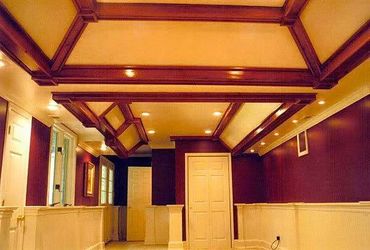 Basement Remodel with tray ceiling, recessed lighting, wainscotting, and a custom box trim package. 