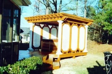 A cabana-style hot tub, pergola with double-sided walls, a lot of router detail work, Gre