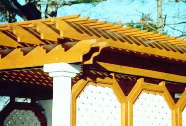 A cabana-style hot tub, pergola with double-sided walls, with router detail work