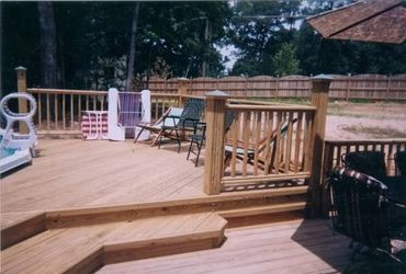 New Pool deck surrounding a 23' above-ground pool with a Greco-Roman inset Hot tub.