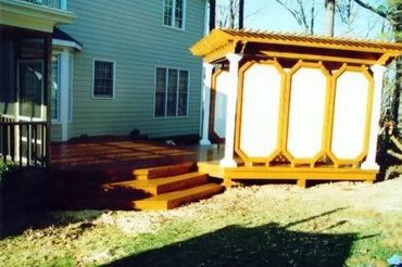 A cabana-style hot tub, pergola with double-sided walls, with router detail work